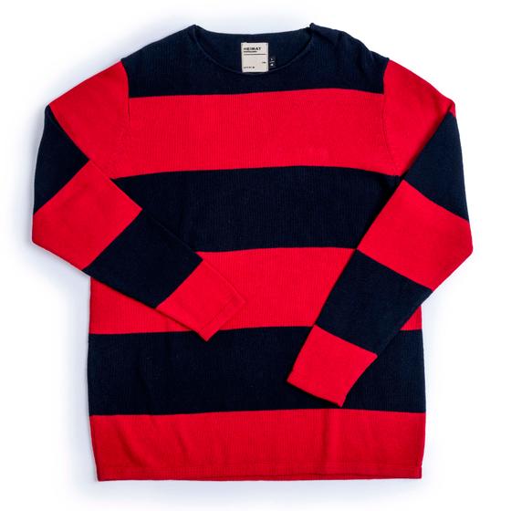 A navy and red block-striped Heimat virgin-wool crewneck sweater laid flat on a white background