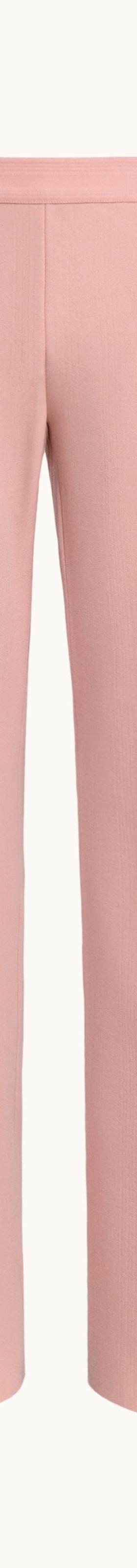 A pale pink High Sport pull-on Kick Pant with pressed front seams