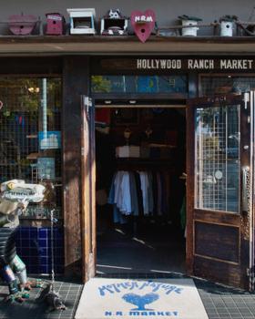 Hollywood Ranch Market Daikanyama shopfront: painted HRM signage, open doors, bench, no people