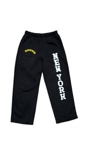 Black Homerun sweatpants with white 'New York' lettering down the leg