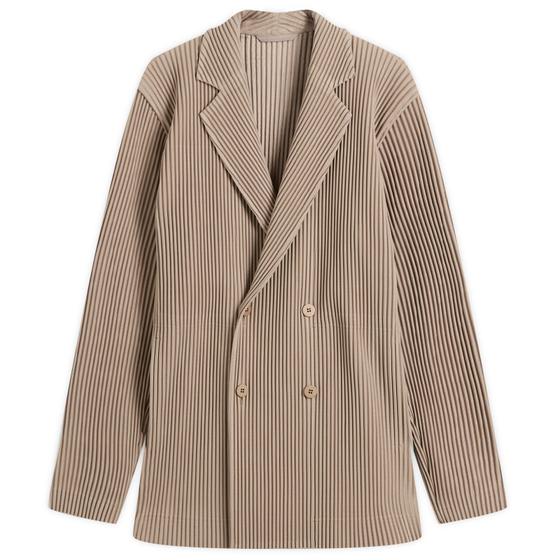A taupe HOMME PLISSÉ ISSEY MIYAKE pleated double-breasted blazer on a plain background
