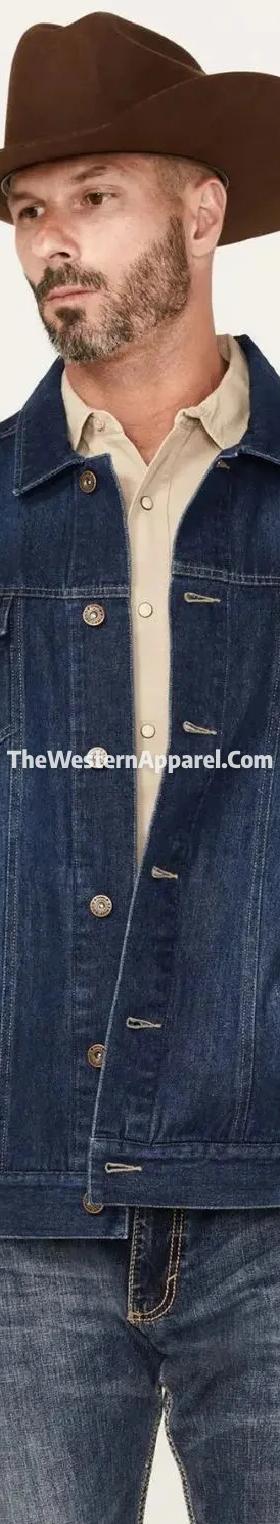 A man wearing a dark denim trucker jacket and felt cowboy hat