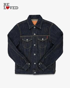 An Iron Heart indigo selvedge denim trucker jacket on a plain white background