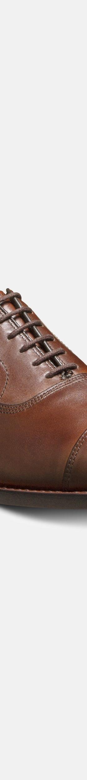 A tan brown leather cap-toe oxford shoe by J. Press