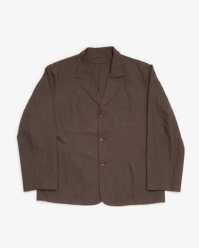 A brown James Coward workwear blazer with patch pockets on a plain background