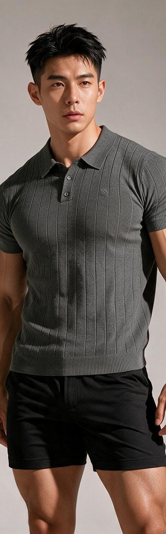 A man wearing a grey ribbed Jed North polo shirt with black shorts