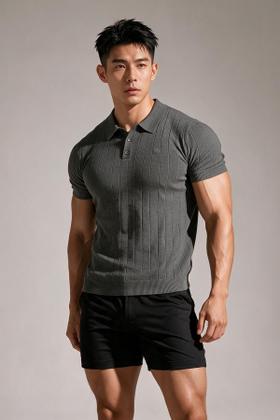 A man wearing a grey ribbed Jed North polo shirt with black shorts
