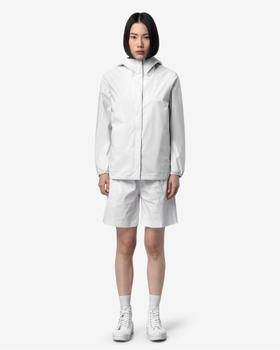 A woman wearing a white K-Way hooded windbreaker jacket with matching shorts