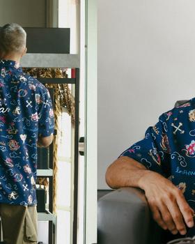 Kahala x IN4MATION model wearing a navy printed aloha shirt