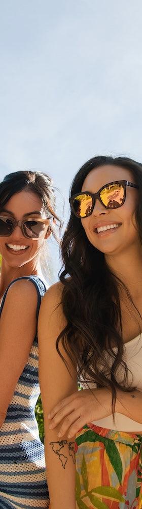 Four friends wearing Knockaround polarized sunglasses outdoors in the sun