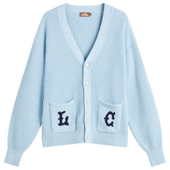 A pale blue Late Checkout ribbed knit cardigan with navy lettered patch pockets