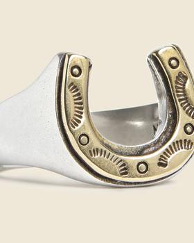 A silver and brass horseshoe signet ring by LHN Jewelry