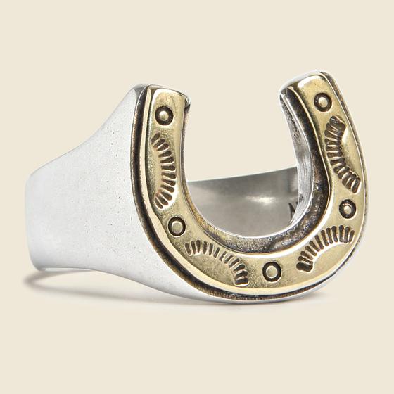 A silver and brass horseshoe signet ring by LHN Jewelry