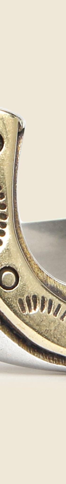 A silver and brass horseshoe signet ring by LHN Jewelry