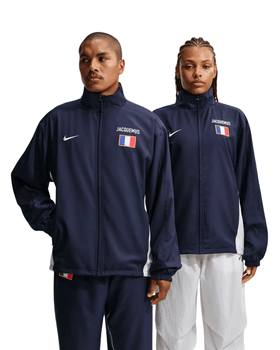 Two models wearing navy Nike x Jacquemus track jackets