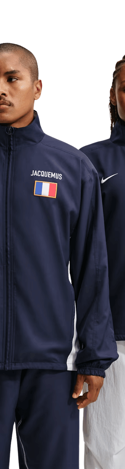 Two models wearing navy Nike x Jacquemus track jackets