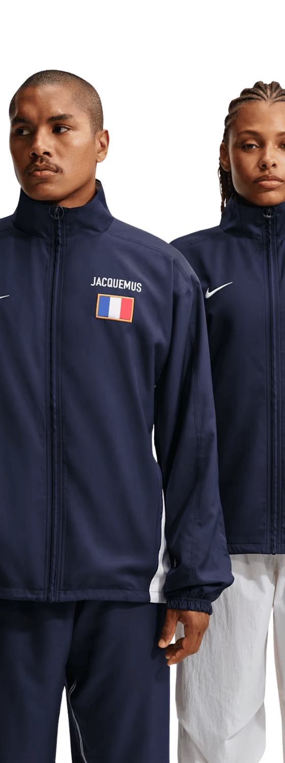 Two models wearing navy Nike x Jacquemus track jackets