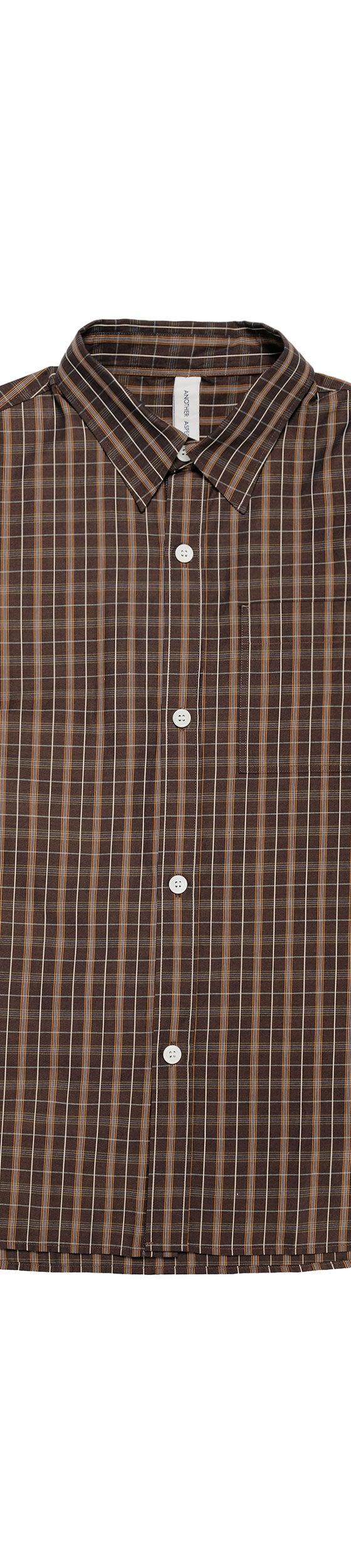 A brown checked long-sleeve overshirt photographed on a plain white background