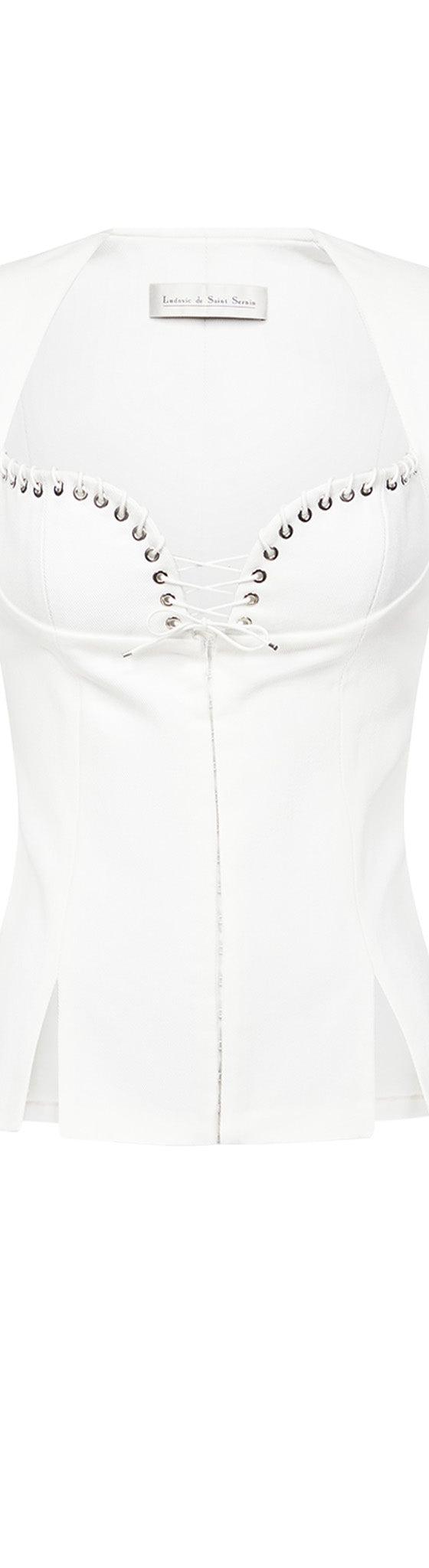A white Ludovic de Saint Sernin corseted jacket with eyelet lace-up neckline