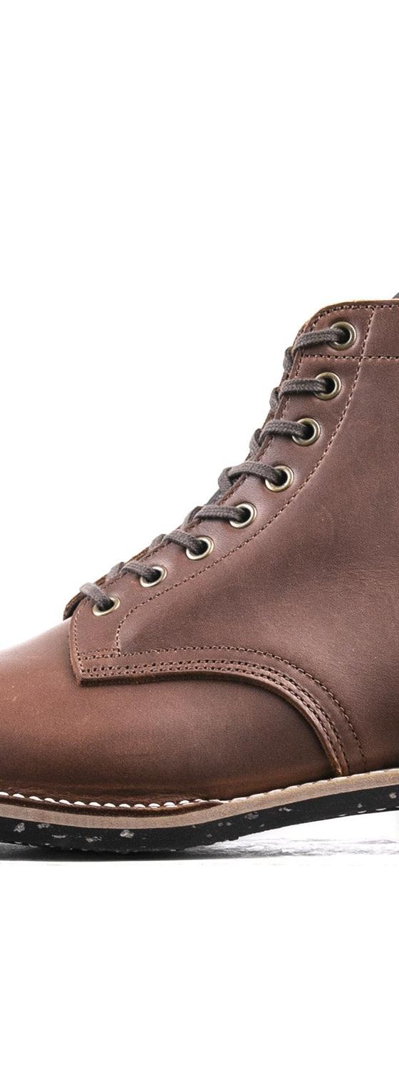 A brown leather Luosjiet cap-toe service boot with a Goodyear welt and speckled black sole