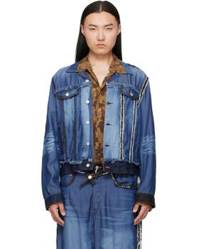 A man wearing a patchwork blue denim Magliano jacket with a printed brown shirt and matching jeans