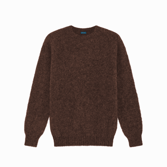 A brown brushed Shetland wool crewneck sweater by Malloch's on a plain background