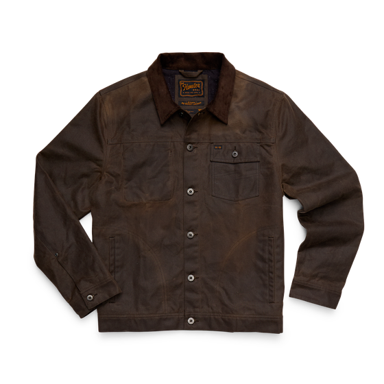 A waxed brown canvas chore jacket with corduroy collar on a plain background