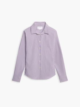 A striped Ministry of Supply performance dress shirt on a plain white background