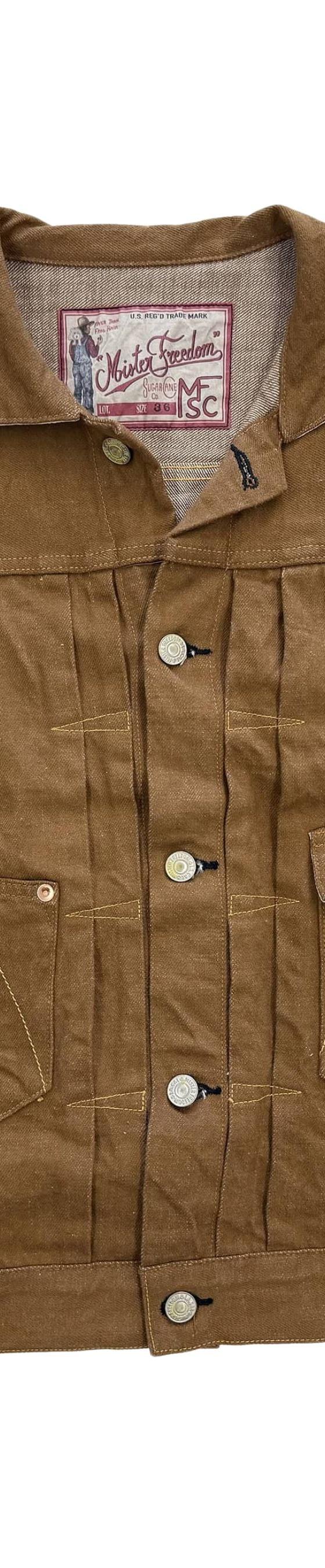 A brown canvas Mister Freedom ranch jacket photographed on a white background