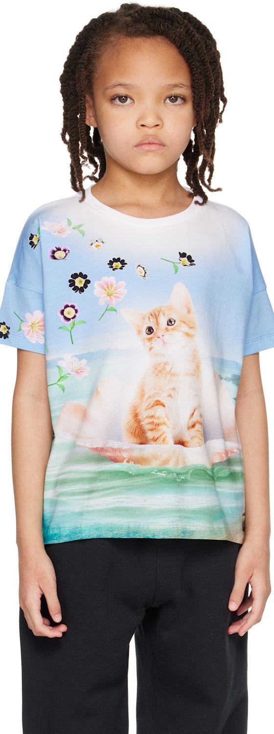 A child wearing a Molo kitten-print T-shirt with black trousers
