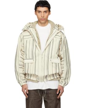 A man wearing a striped off-white Mordecai hooded bomber jacket