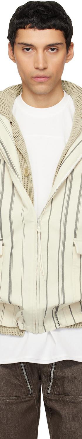 A man wearing a striped off-white Mordecai hooded bomber jacket