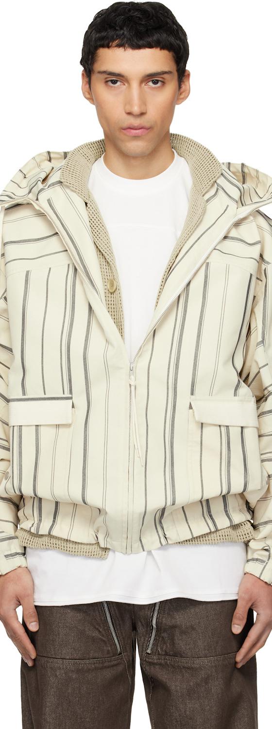 A man wearing a striped off-white Mordecai hooded bomber jacket