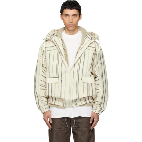 A man wearing a striped off-white Mordecai hooded bomber jacket