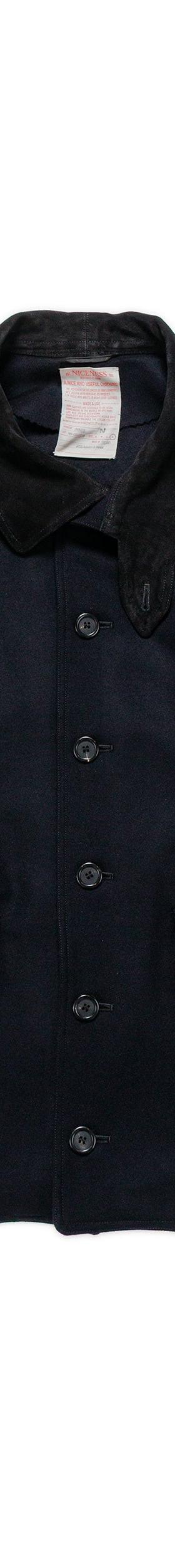 A navy wool NICENESS chore jacket with a corduroy collar on a plain background