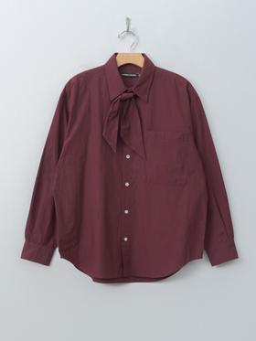 A burgundy Nicholson & Nicholson tie-neck cotton shirt on a hanger