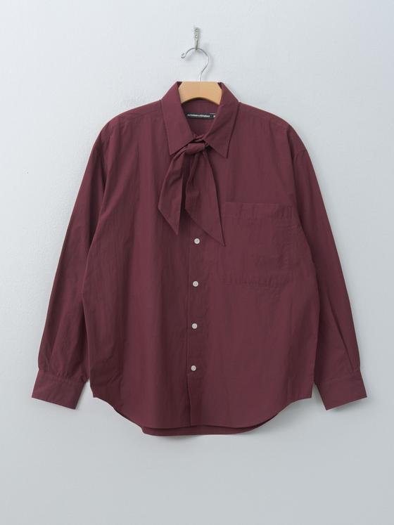 A burgundy Nicholson & Nicholson tie-neck cotton shirt on a hanger