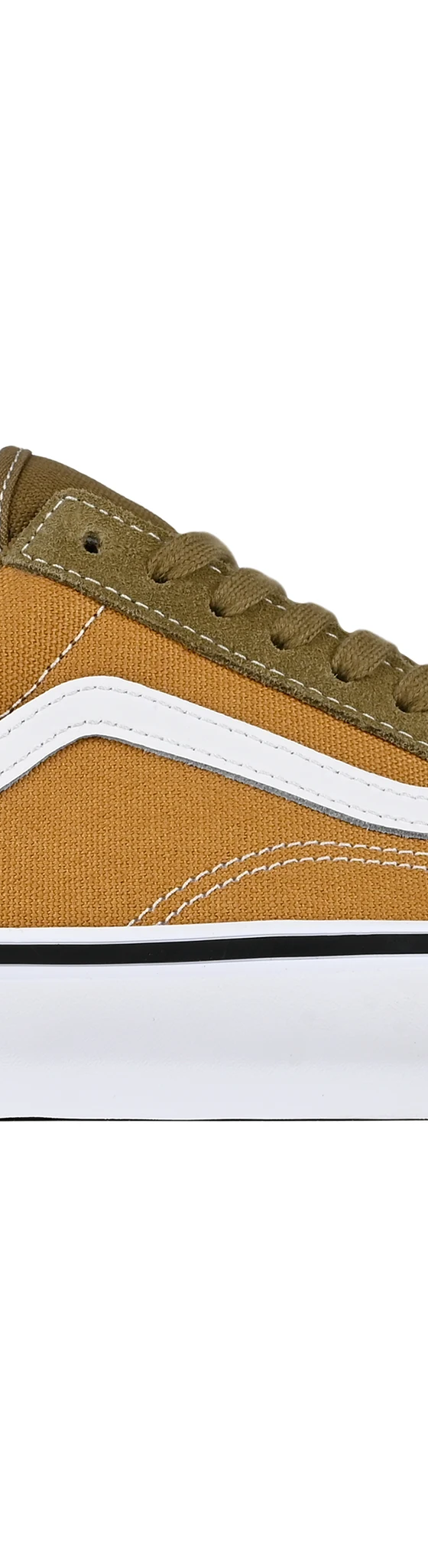 A pair of olive and tan suede skate shoes on a plain white background