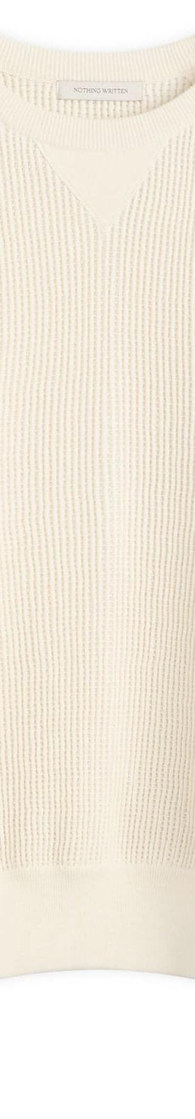 A cream waffle-knit crewneck sweater by Nothing Written