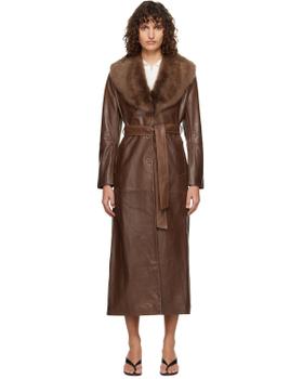 A woman wearing a brown Nour Hammour leather coat with a shearling collar
