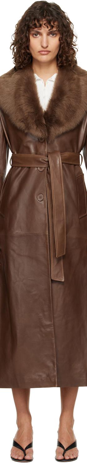 A woman wearing a brown Nour Hammour leather coat with a shearling collar