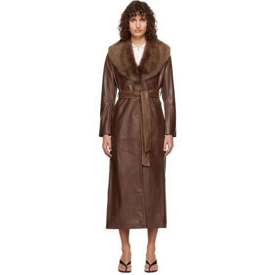 A woman wearing a brown Nour Hammour leather coat with a shearling collar