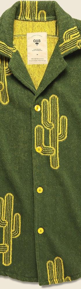 A green OAS cotton terry camp shirt with yellow cactus print