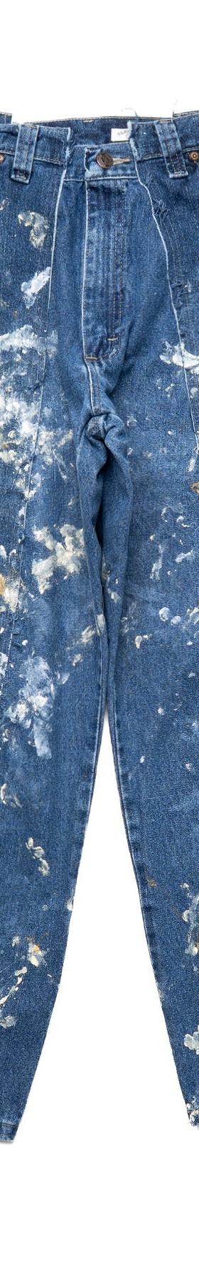 A pair of OLD PARK reconstructed paint-splattered vintage carpenter jeans on a white background