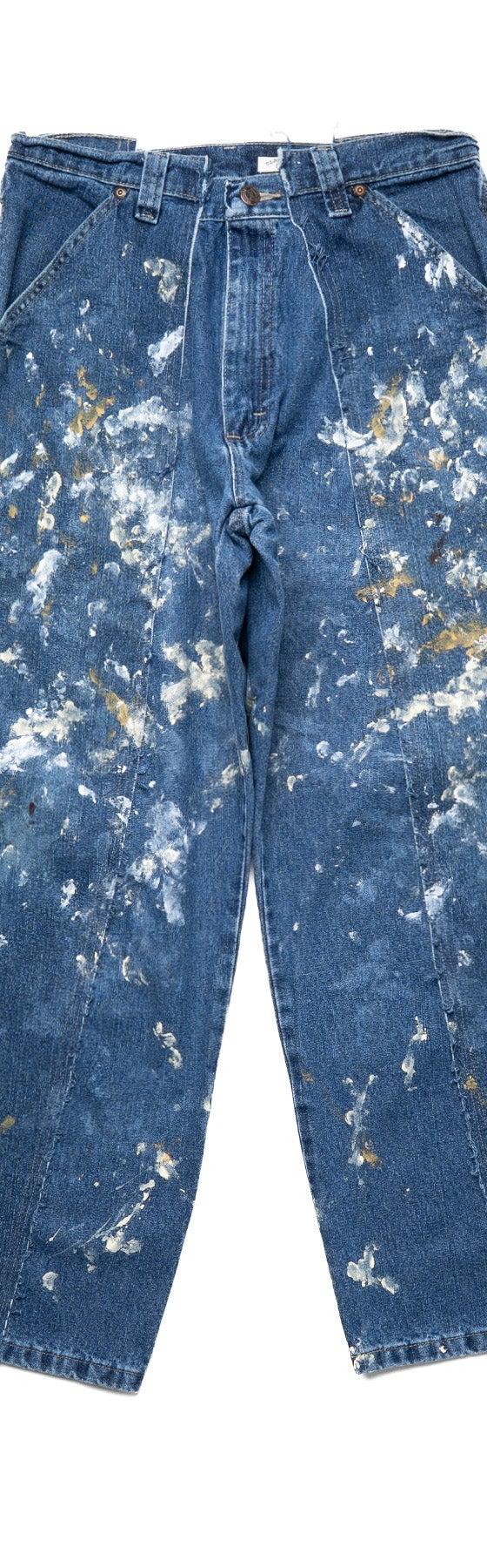 A pair of OLD PARK reconstructed paint-splattered vintage carpenter jeans on a white background