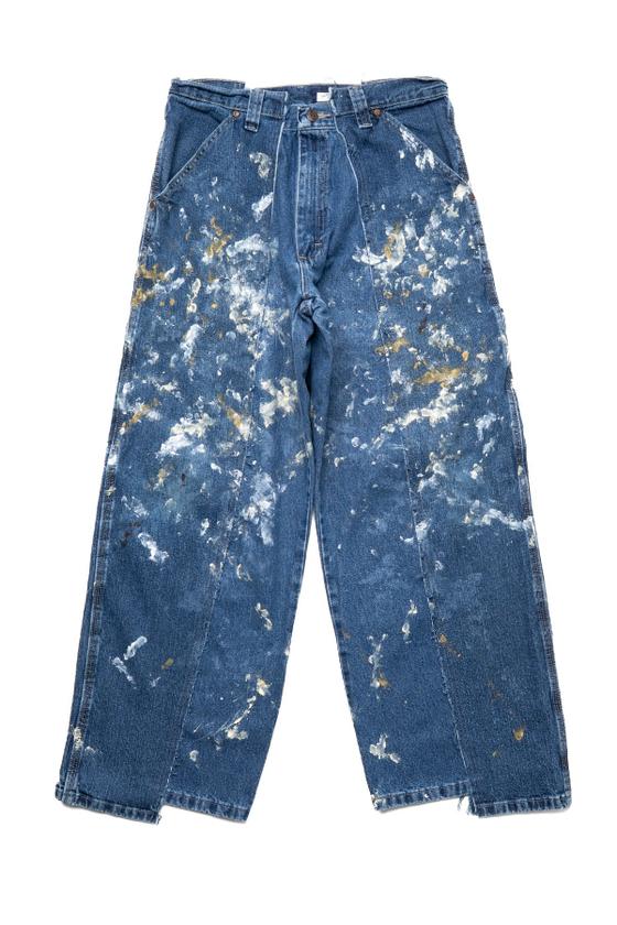 A pair of OLD PARK reconstructed paint-splattered vintage carpenter jeans on a white background