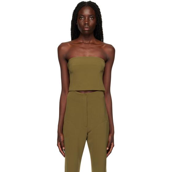 A woman wearing an olive green Paris Georgia strapless tube top with matching high-waisted trousers