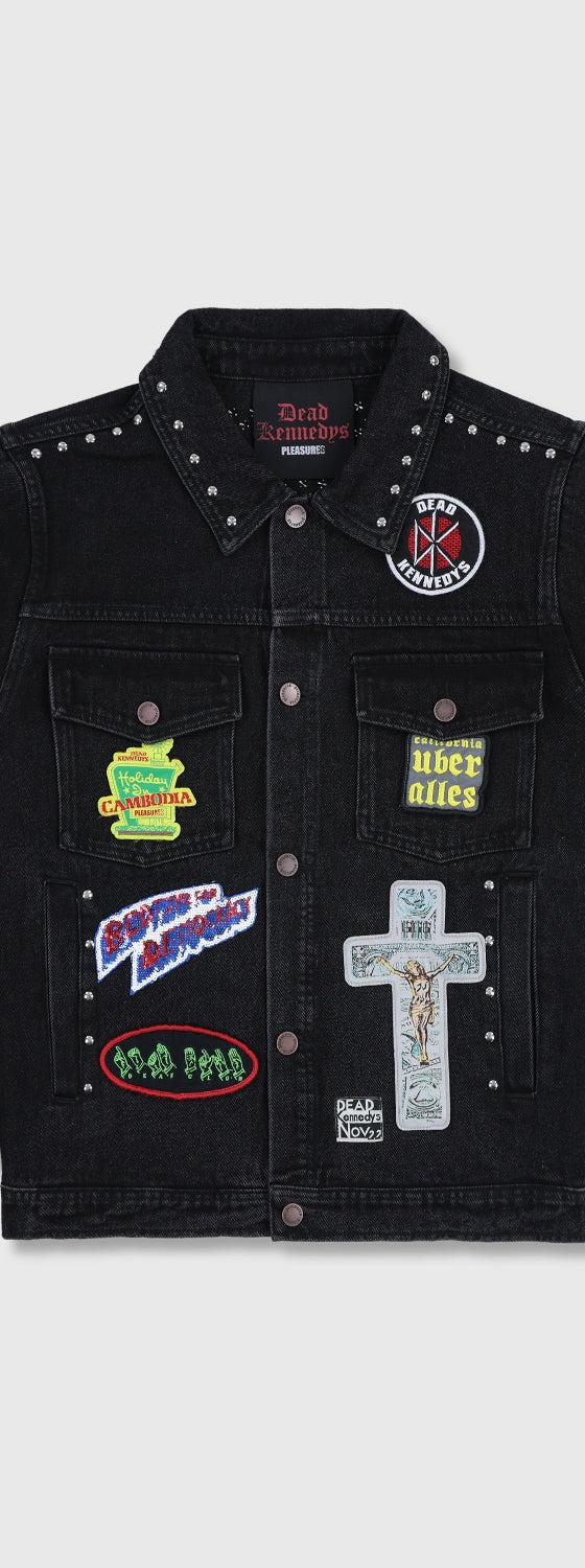A black studded denim jacket with punk patches from PLEASURES
