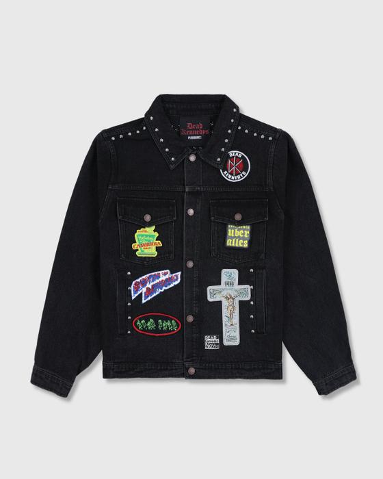 A black studded denim jacket with punk patches from PLEASURES