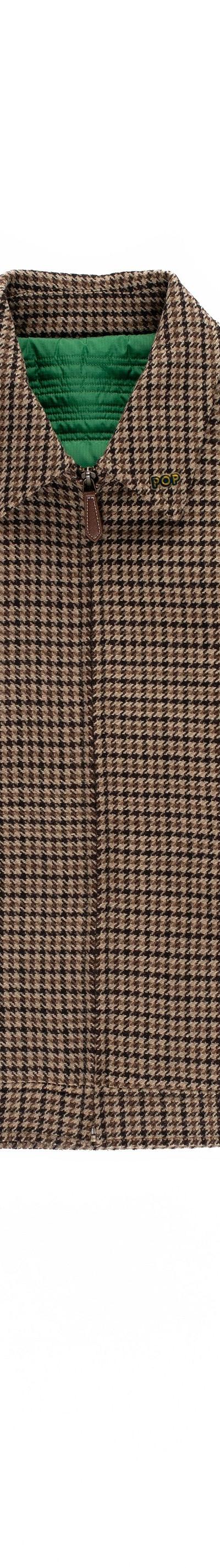 A brown houndstooth Pop Trading Company zip-up jacket on a plain white background